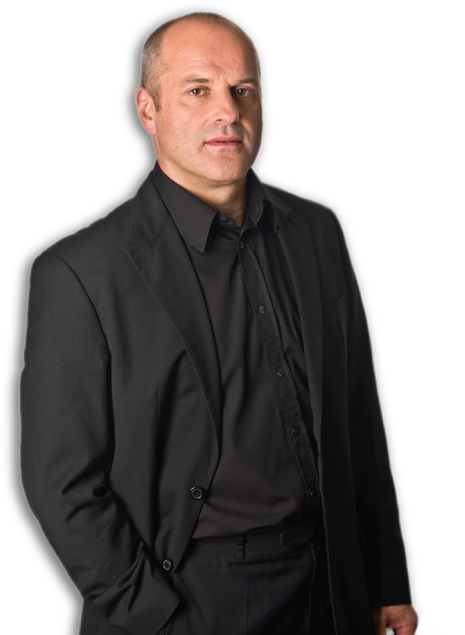 A full length portrait photograph of Christopher Purves